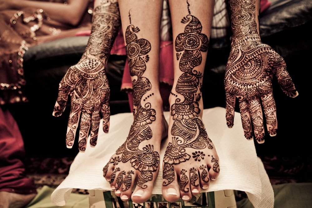 How Do Bridal Henna Designs Symbolize Love and Marriage?